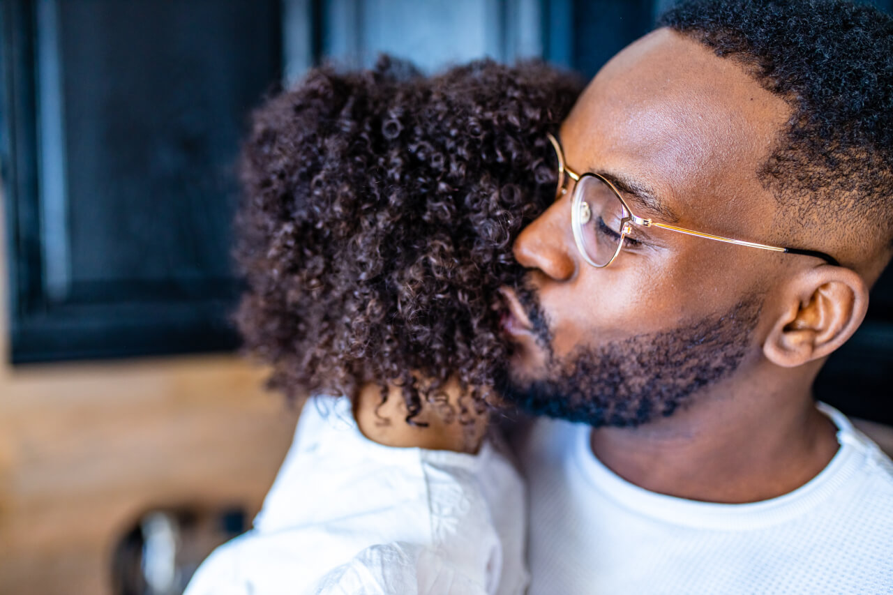 man kissing girl